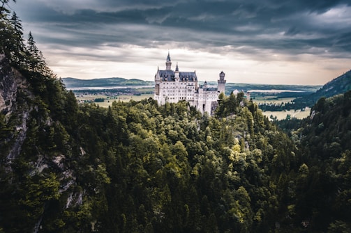 A mystical landscape with castles and mythical creatures.