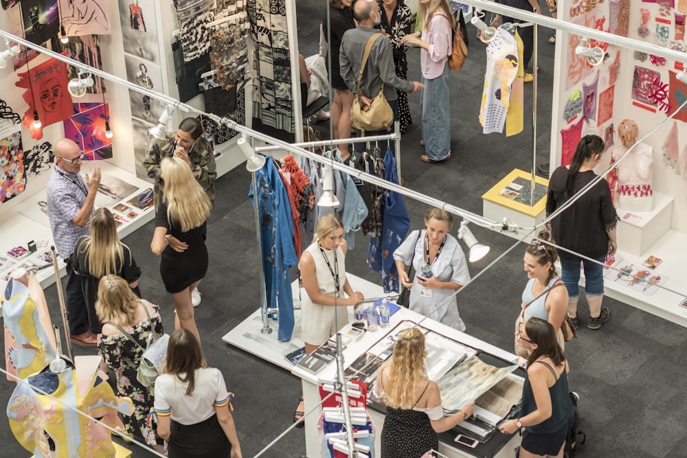 group of people gather in clothes stores