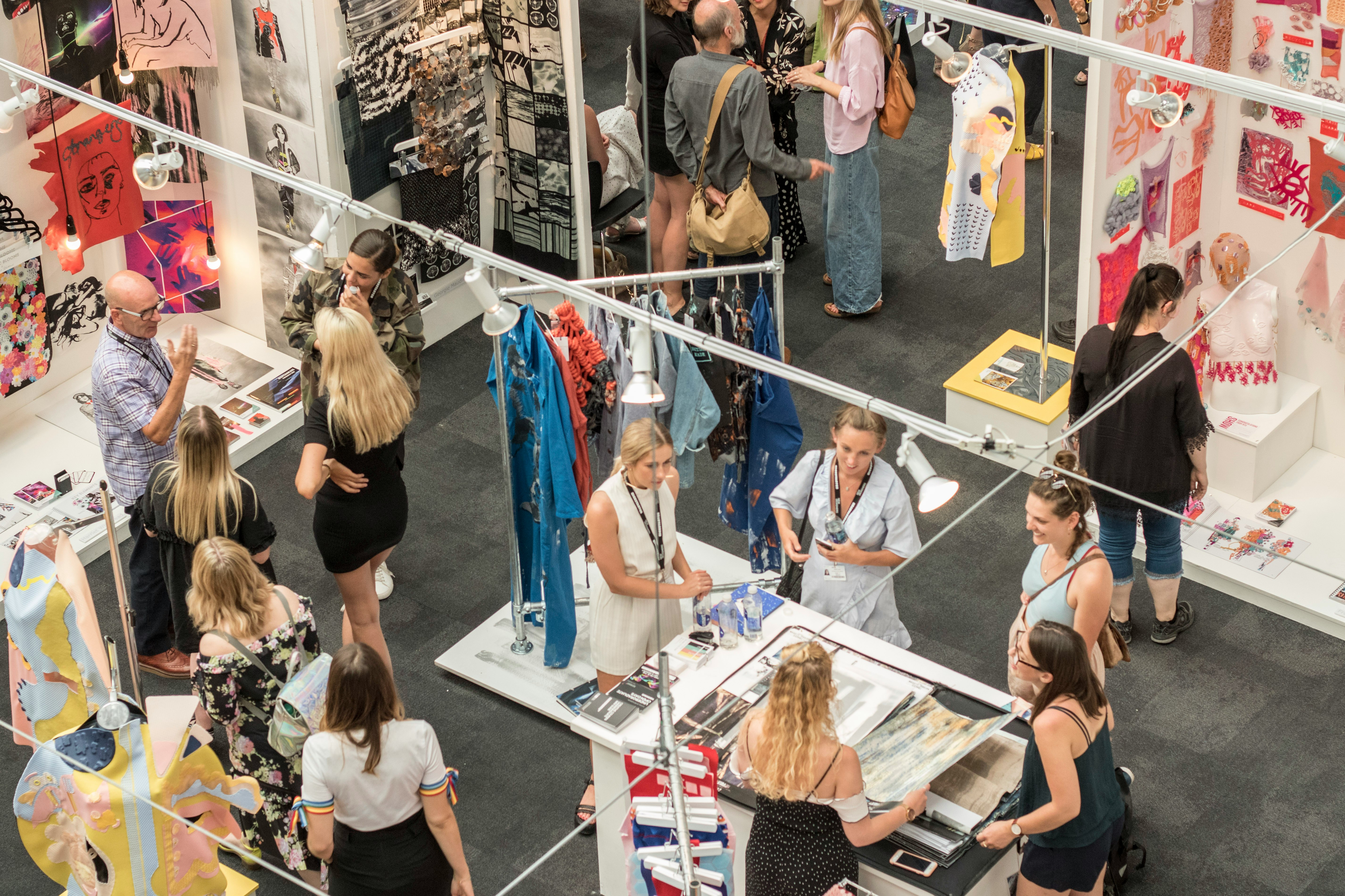 group of people gather in clothes stores