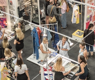 group of people gather in clothes stores