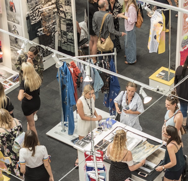 group of people gather in clothes stores