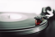 A close-up of a vinyl record spinning on a turntable.