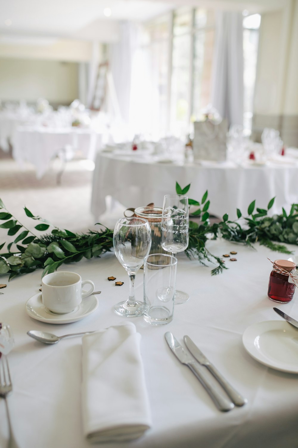 selective focus photography of clear wine glasses on table