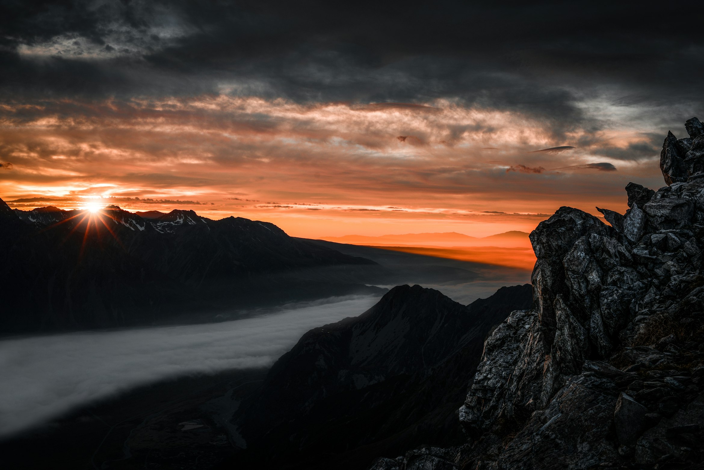 Mountain Range under Nimbus Clouds