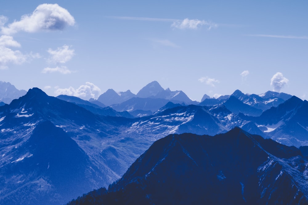 mountain rage view under blue sky during daytime