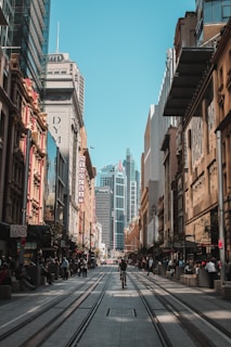 people on marker beside road