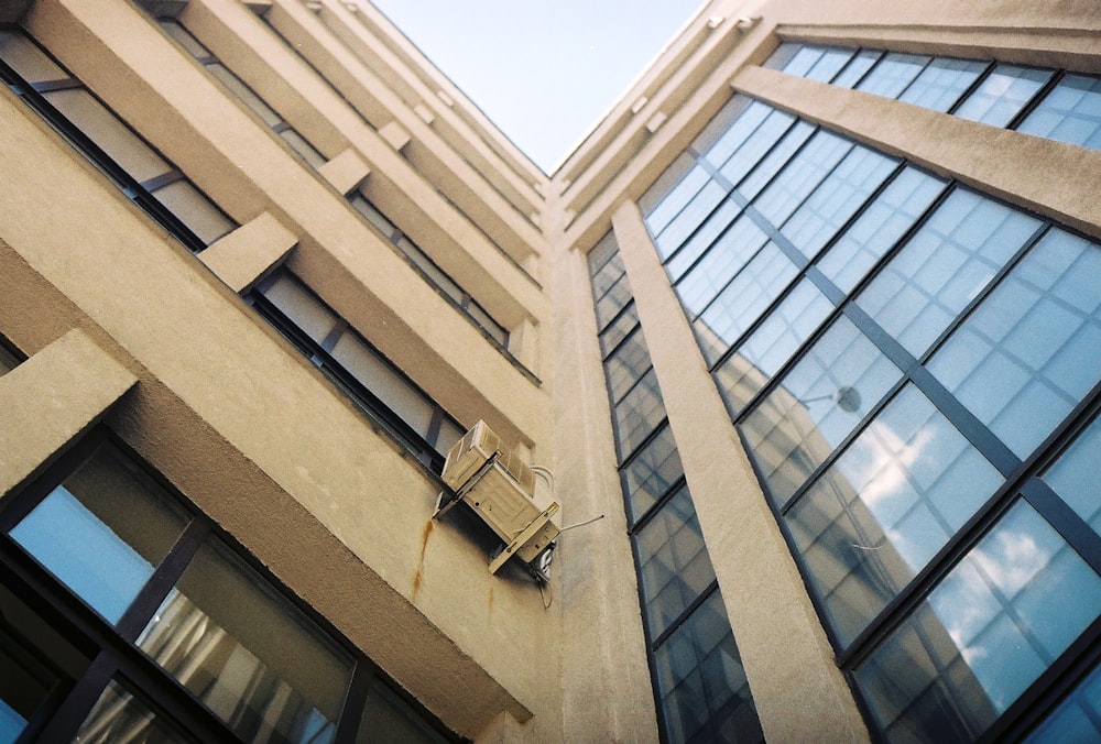 low-angle photo of curtain wall building