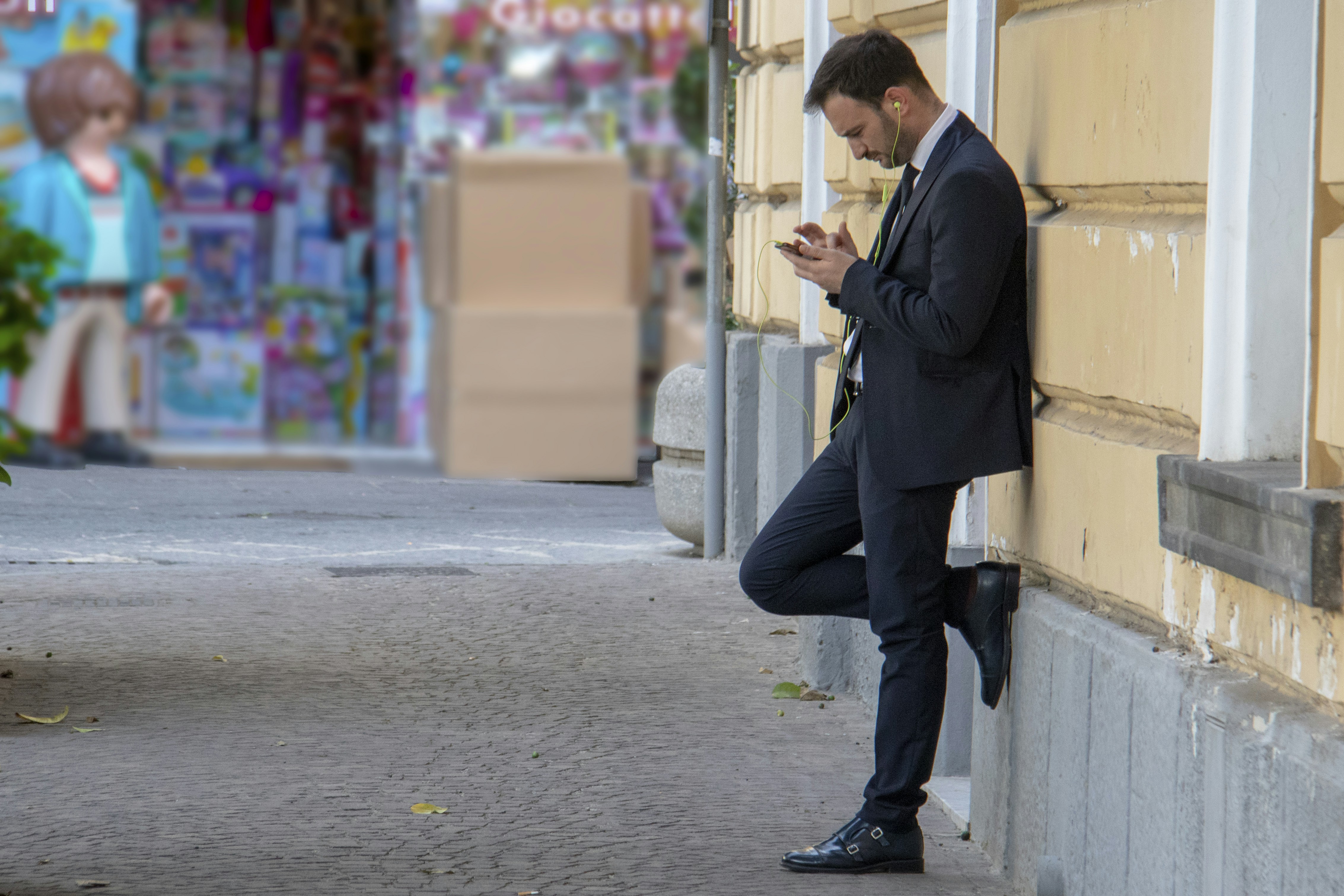 I was in Sorrento on vacation and noticed the young businessman down a side street, checking his mobile phone or indeed, choosing the next music track to listen to. I just liked the look of his stance and the fact that he was oblivious to everything around him.