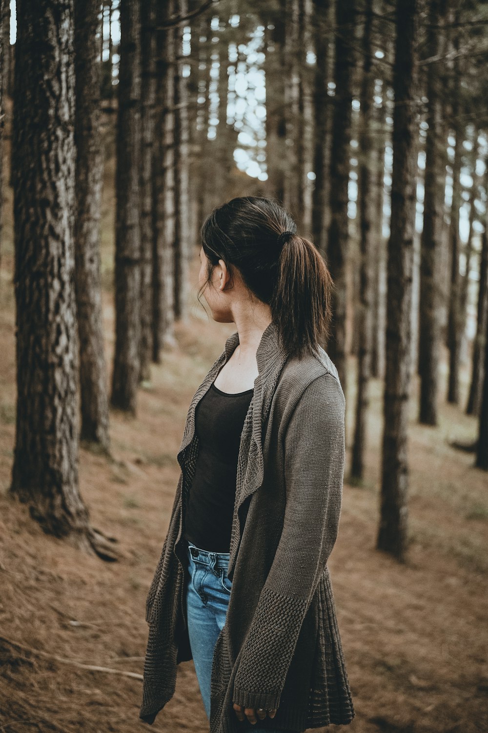 selective focus photography of woman looking back