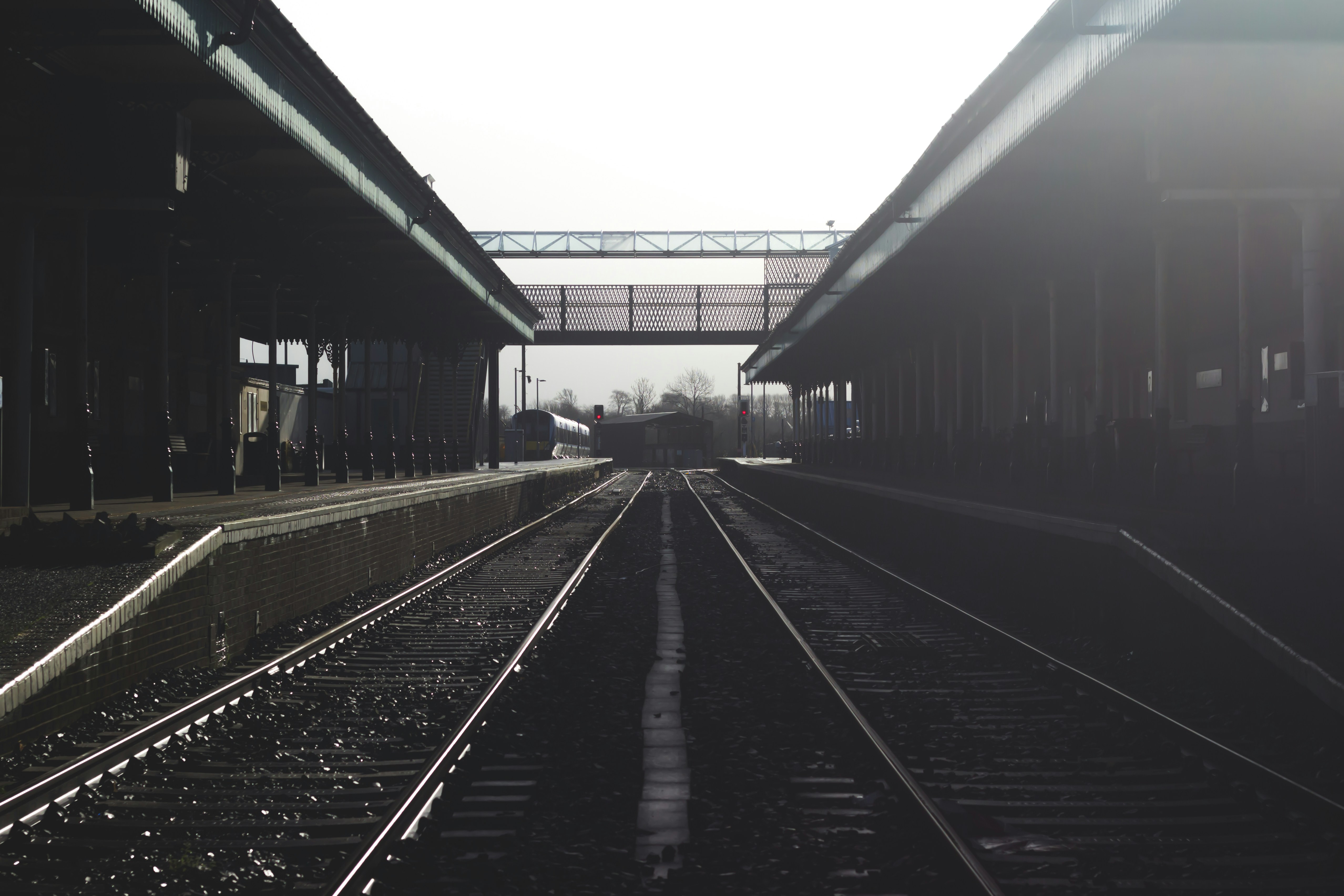 black metal train railways, This photo was taken during my trip to Ireland. The rebel in me wanted to jump right in there and take a quick shot (and I did!). I captured this right after it finished snowing so the weather was kind of dark and eery.
