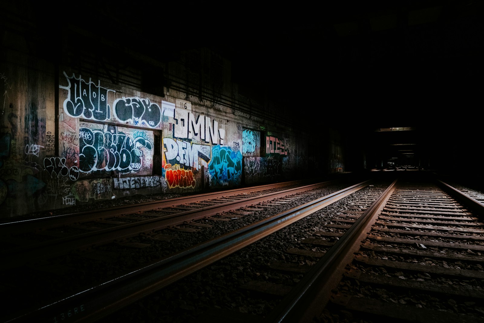Fujifilm X-Pro2 sample photo. Railway beside graffiti wall photography