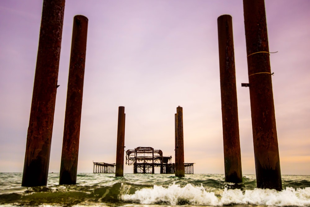 large wood posts at sea