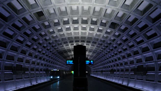A sleek digital metro rail map glowing on a dark background.