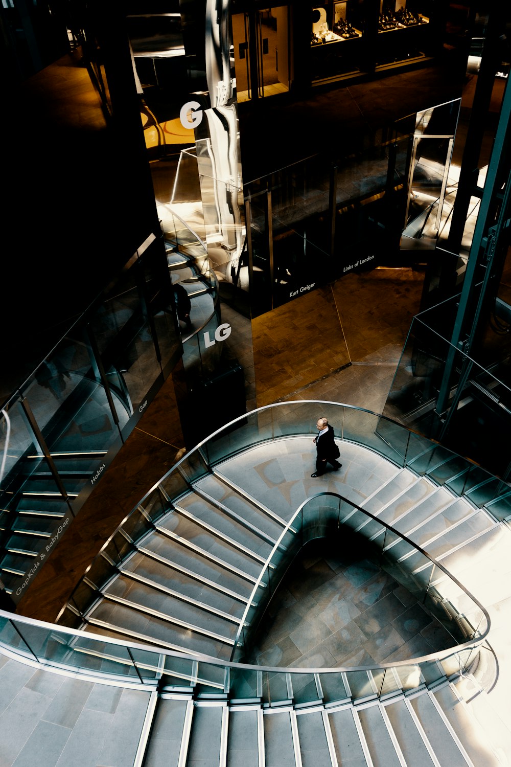 man wearing black shirt on the stairs