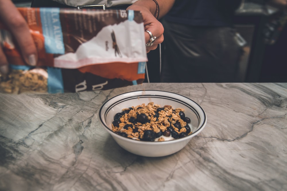 flux seed oatmeal on white ceramic bowl