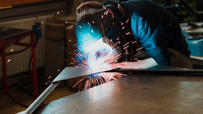 man welding iron