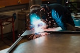man welding iron