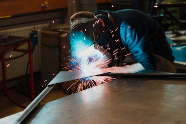 man welding iron