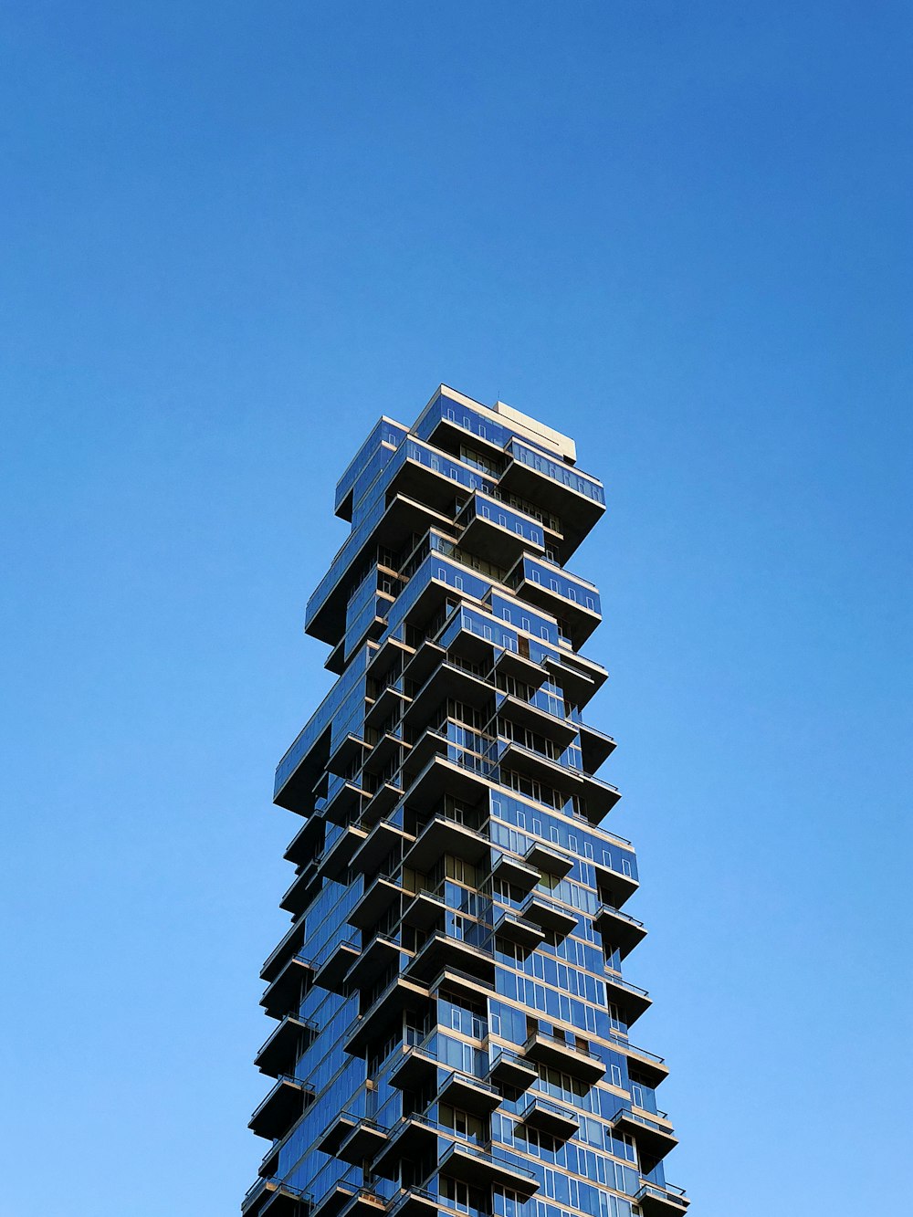 clear glass building under blue sky