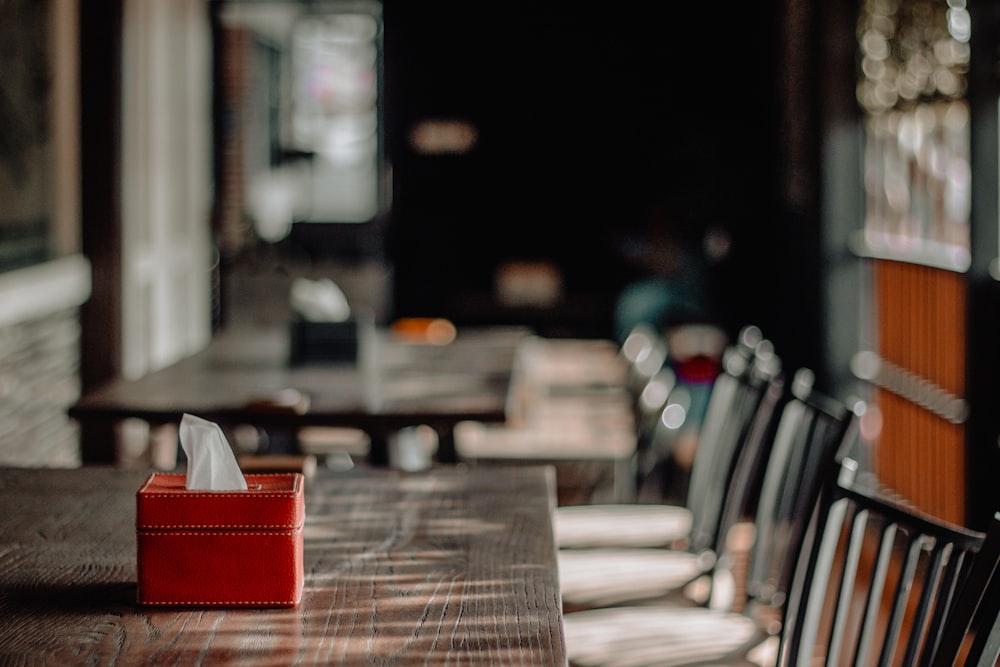 red tissue paper box on table