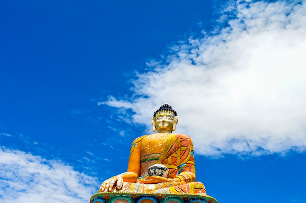 multicolored Buddha statue at day