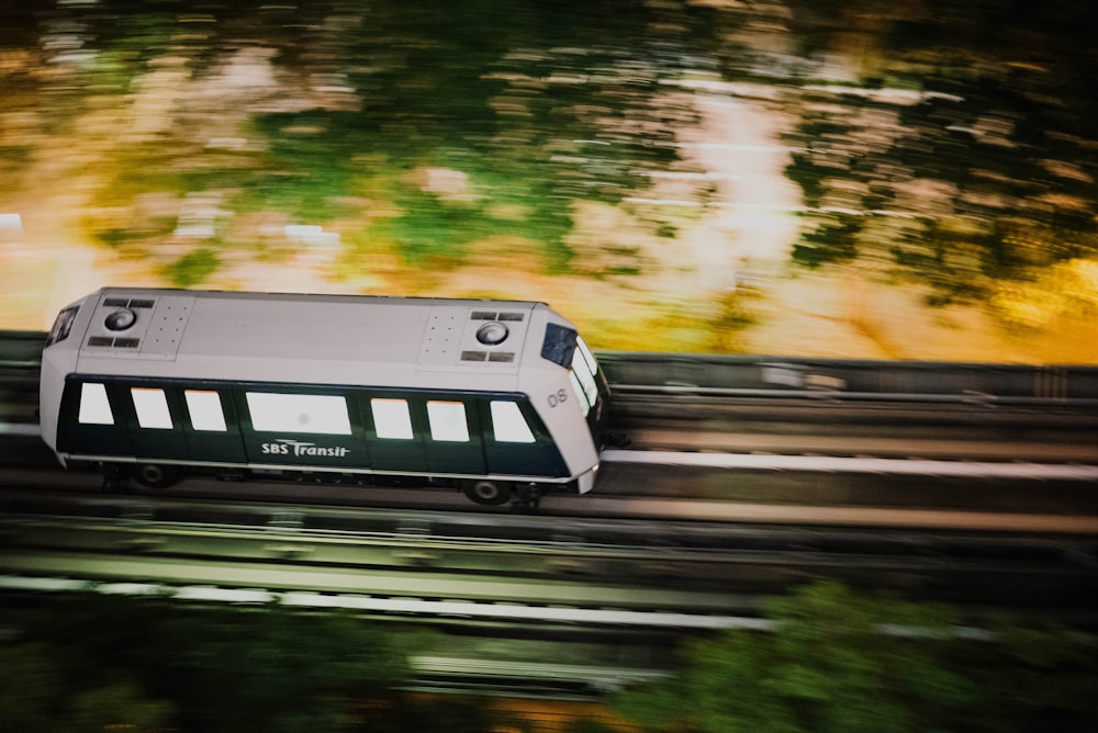 panning photography of train on railway