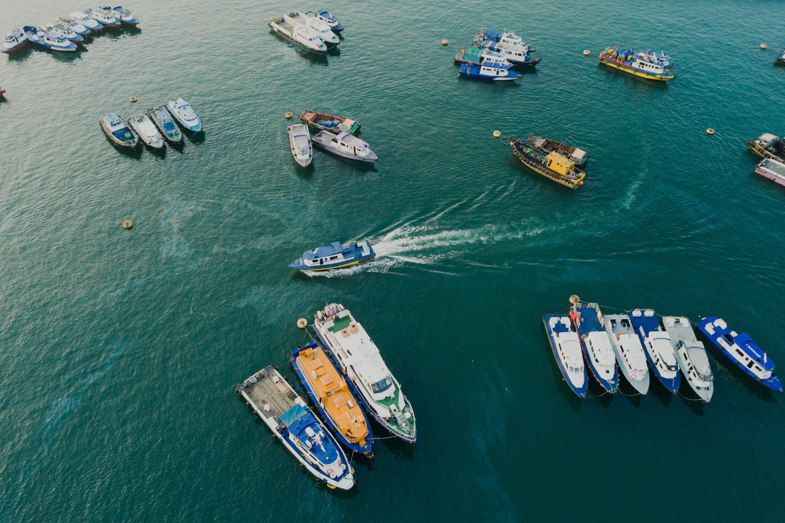 Yacht seen from above in open blue water