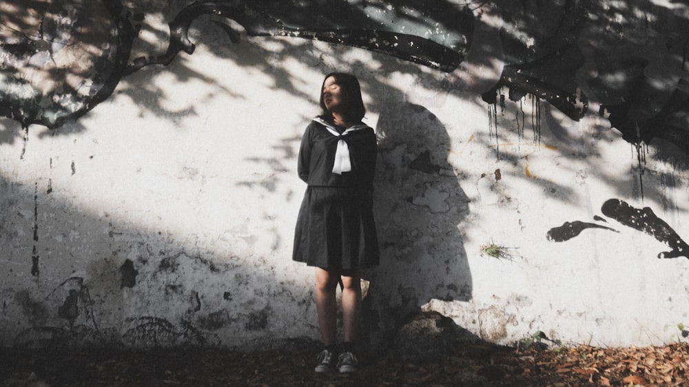 woman standing near wall