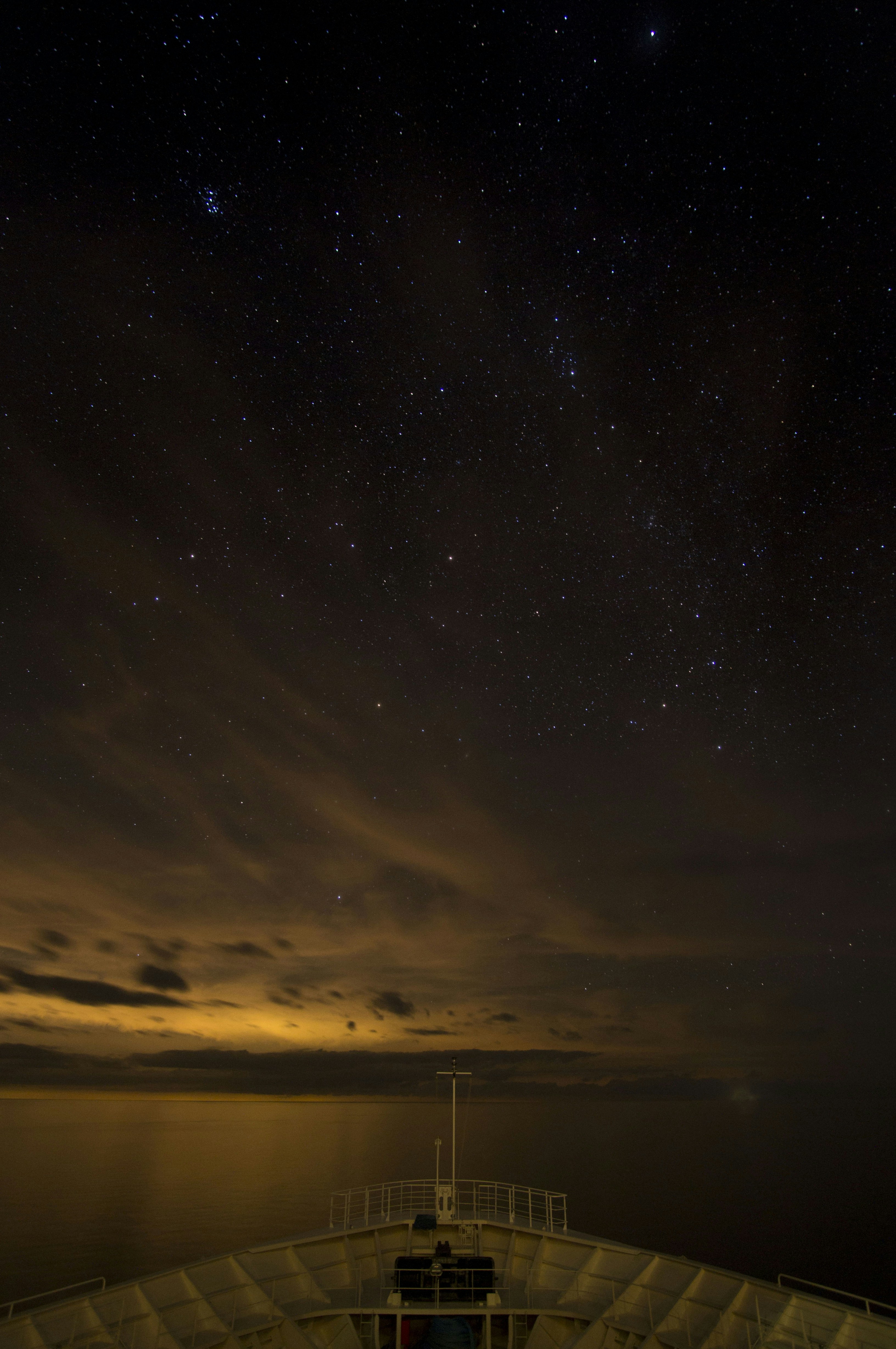 body of water under starry sky