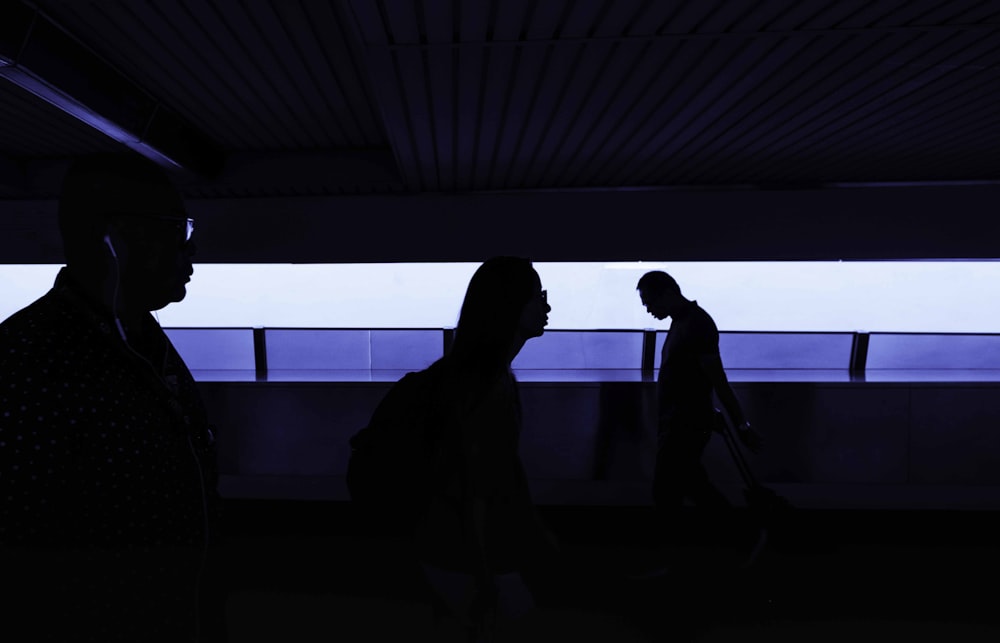 silhouette of people inside a dark room