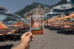 person holding outdoor lounge chairs photo