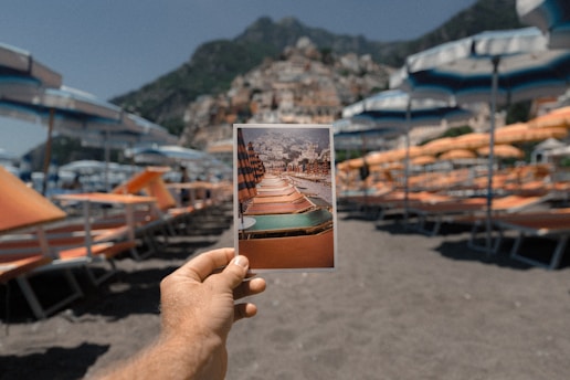 person holding outdoor lounge chairs photo