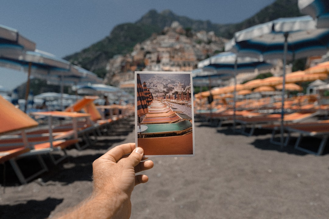 person holding outdoor lounge chairs photo, Just Beachy