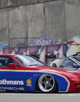 red and blue Rothmas coupe parking