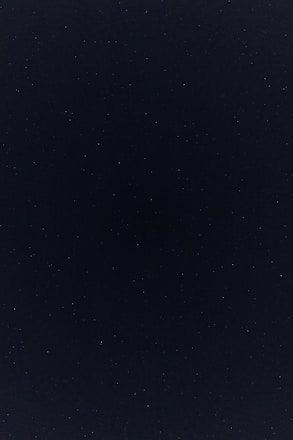 a night sky with a few stars in it
