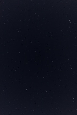 a night sky with a few stars in it
