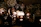 Softly lit candles arranged on a pastel-colored table setting for a baby shower.