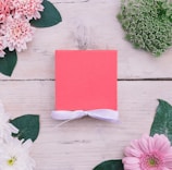 An elegant flat lay of a box with feminine touches in nude and beige tones, embodying premium gifting.