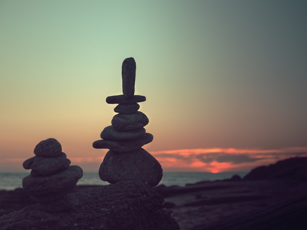 two zen stones on rock