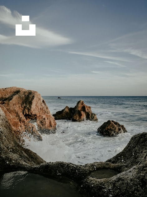 Premium Photo  Sea with waves and foam rocks landscape