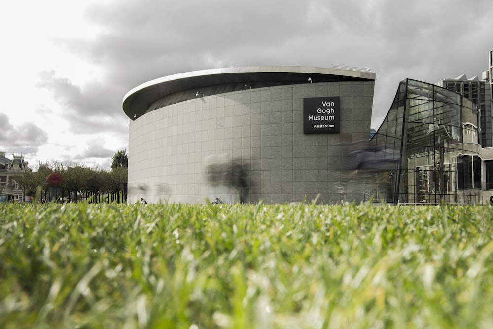 gray concrete building near grass field