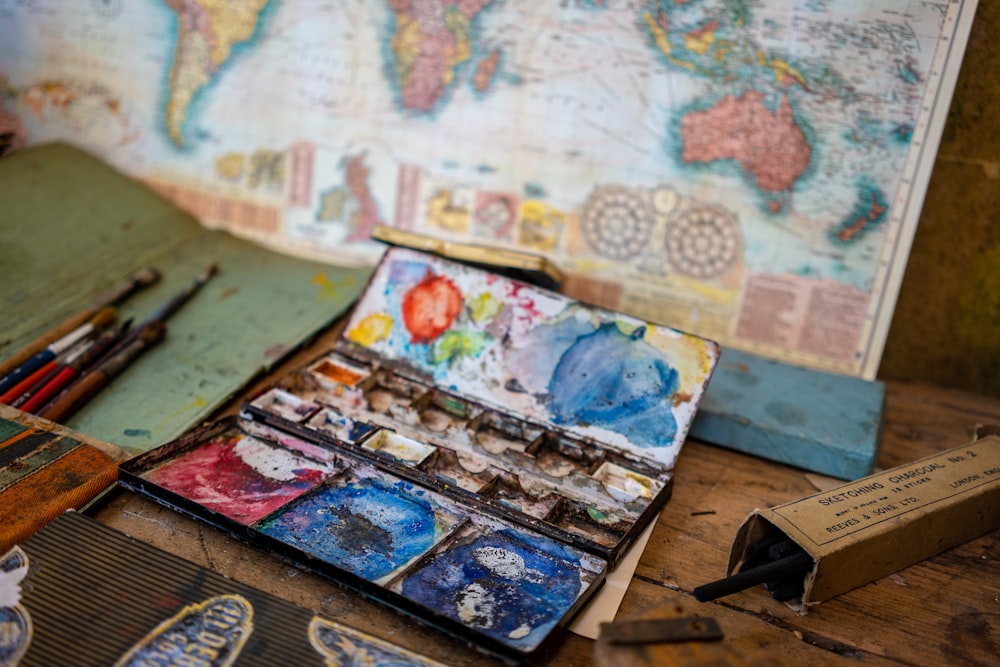 world map painting on brown wooden floor