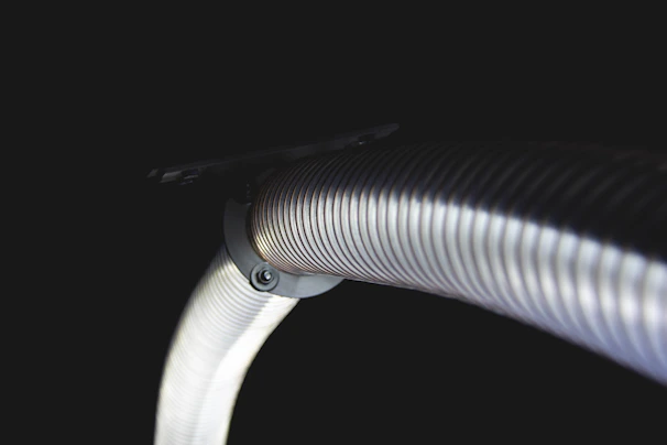 Flexible PVC hose being bent to demonstrate its durability and strength
