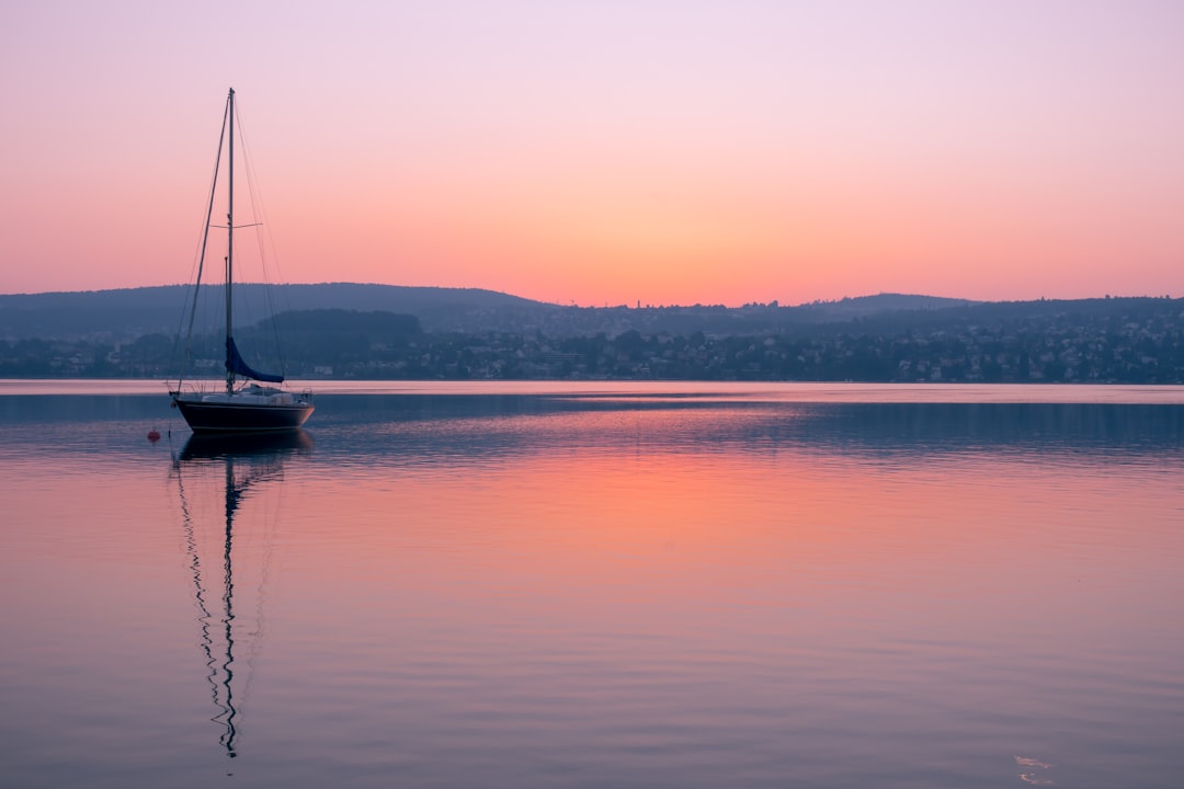 sailboat on water at golden hour