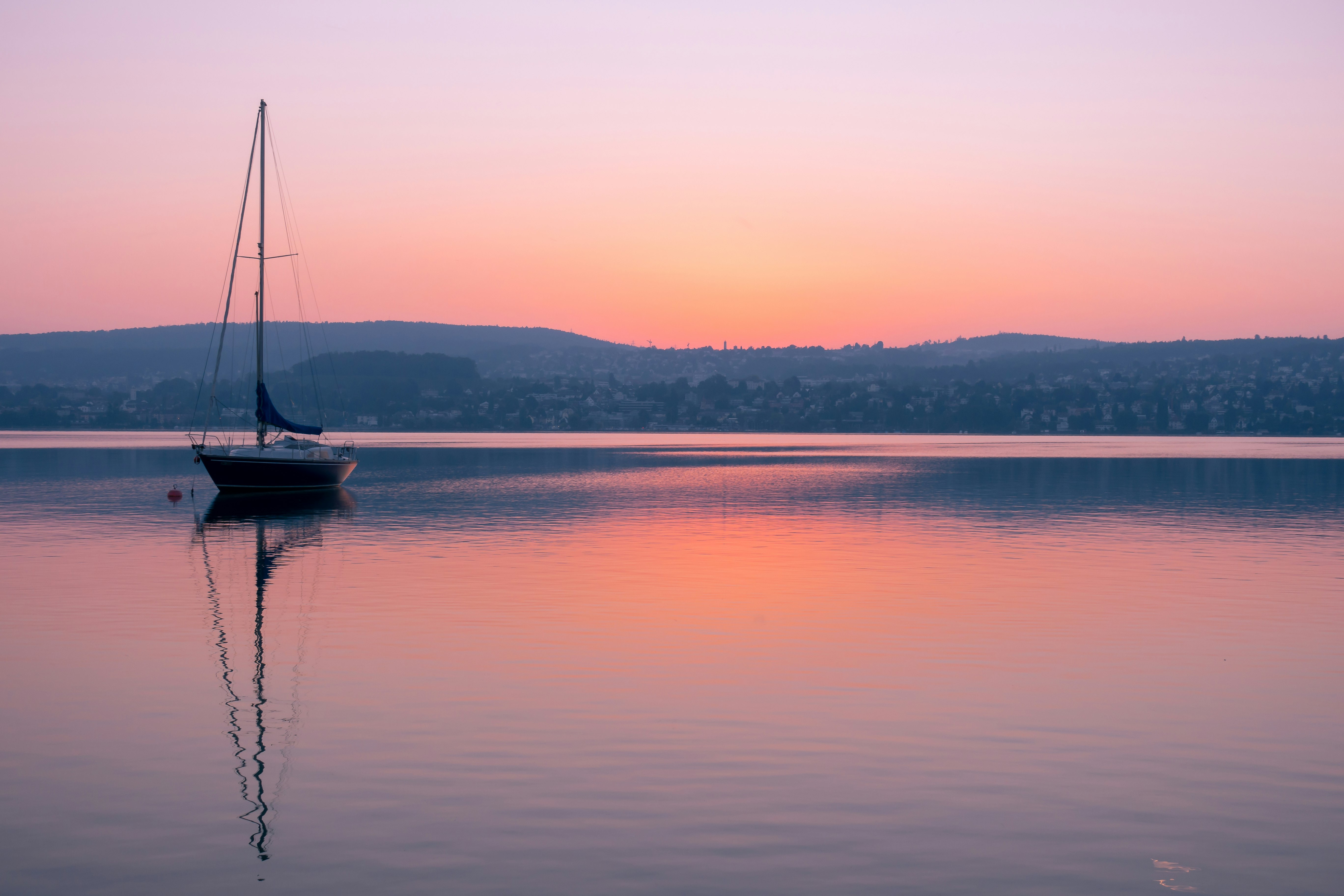 sailboat on water at golden hour