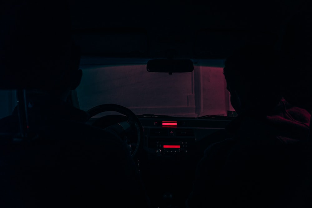 two person sitting on car seat