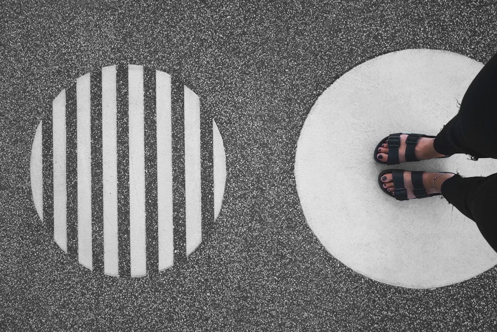 person standing on round concrete pavement