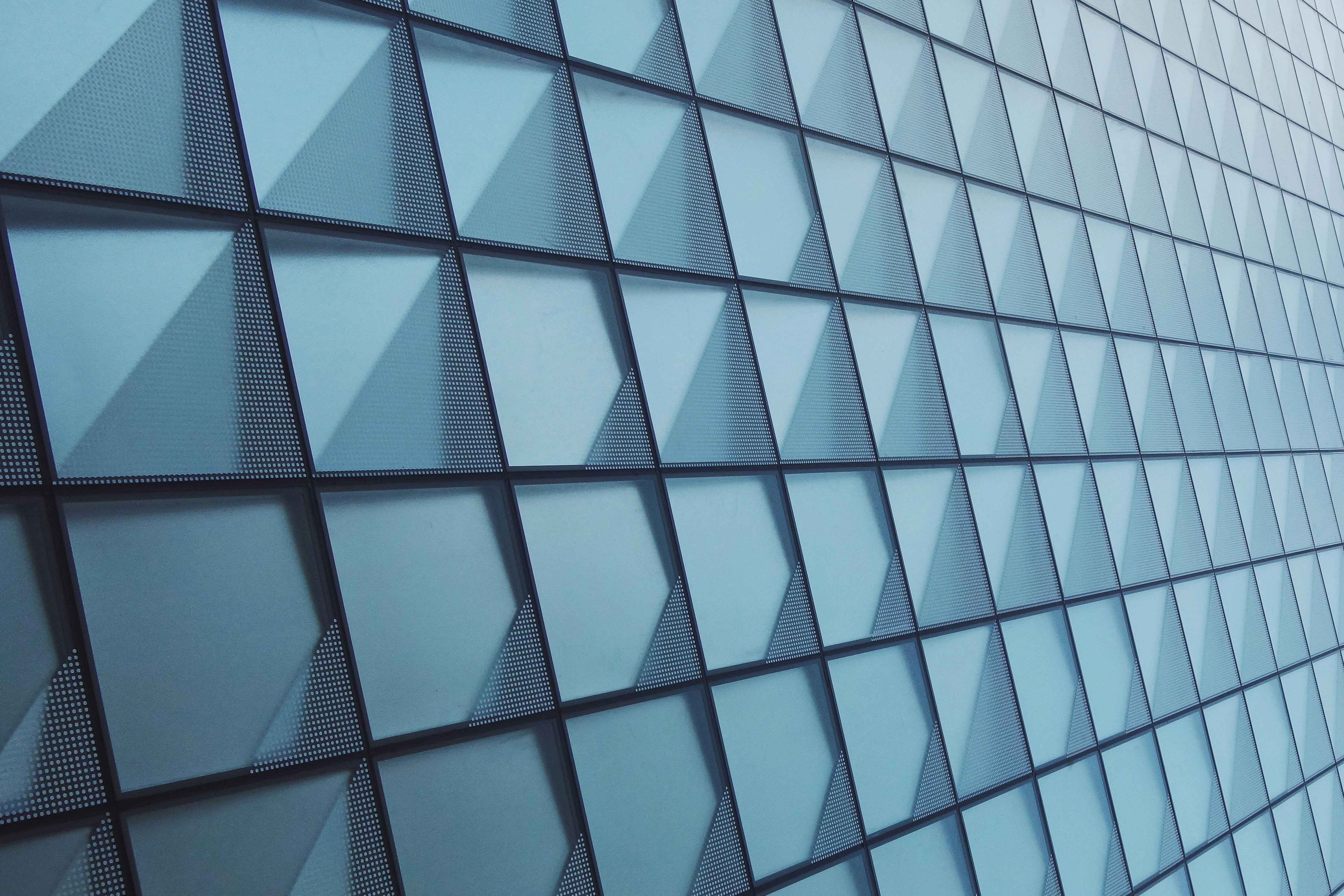 a close up of a wall made of glass blocks, Identical