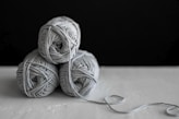 three yarns on table