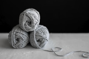 three yarns on table